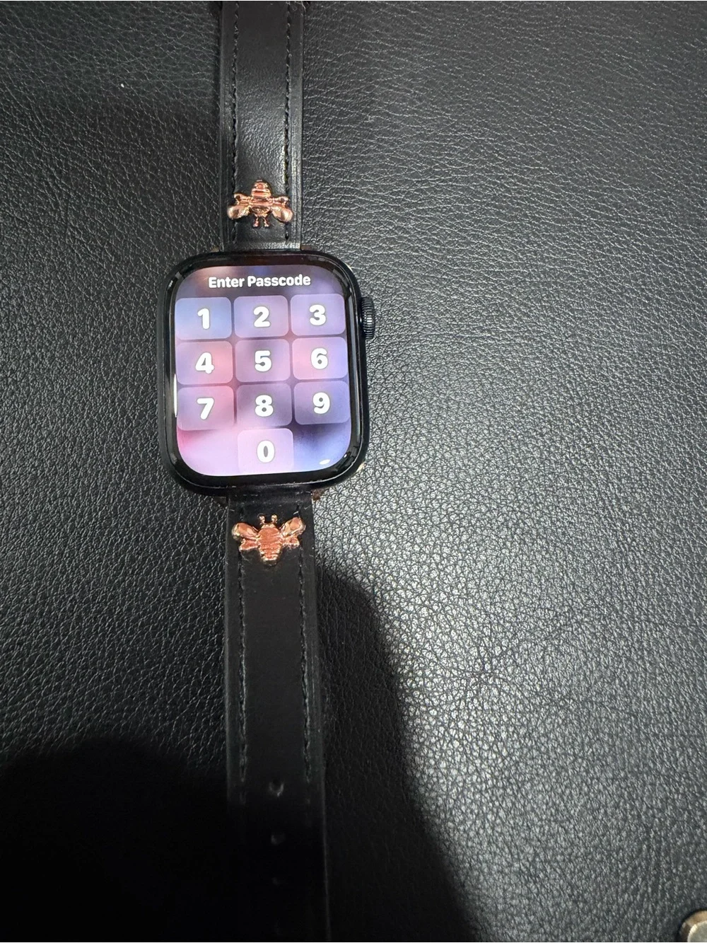 Apple Smartwatch with Black Case and Rose Gold Accents